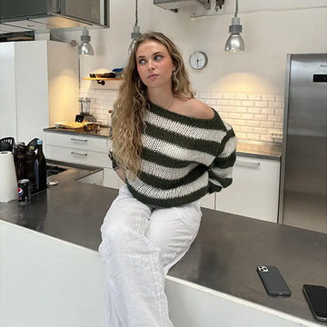 Cozy loose striped off-the-shoulder pullover sweater for women with bold dark green and white horizontal stripes in soft knit