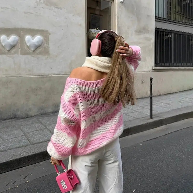 Loose striped pullover sweater for women in pink and white knit with cozy off-the-shoulder design and diagonal stripes