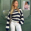 Navy and white horizontally striped knit loose pullover sweater for women with a cozy loose striped design