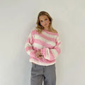 Cozy loose striped off-the-shoulder pullover sweater for women in chunky knit with wide pink and white diagonal stripes