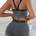 Gray heathered love letter camisole and leggings set with black elastic bands featuring bold brand lettering