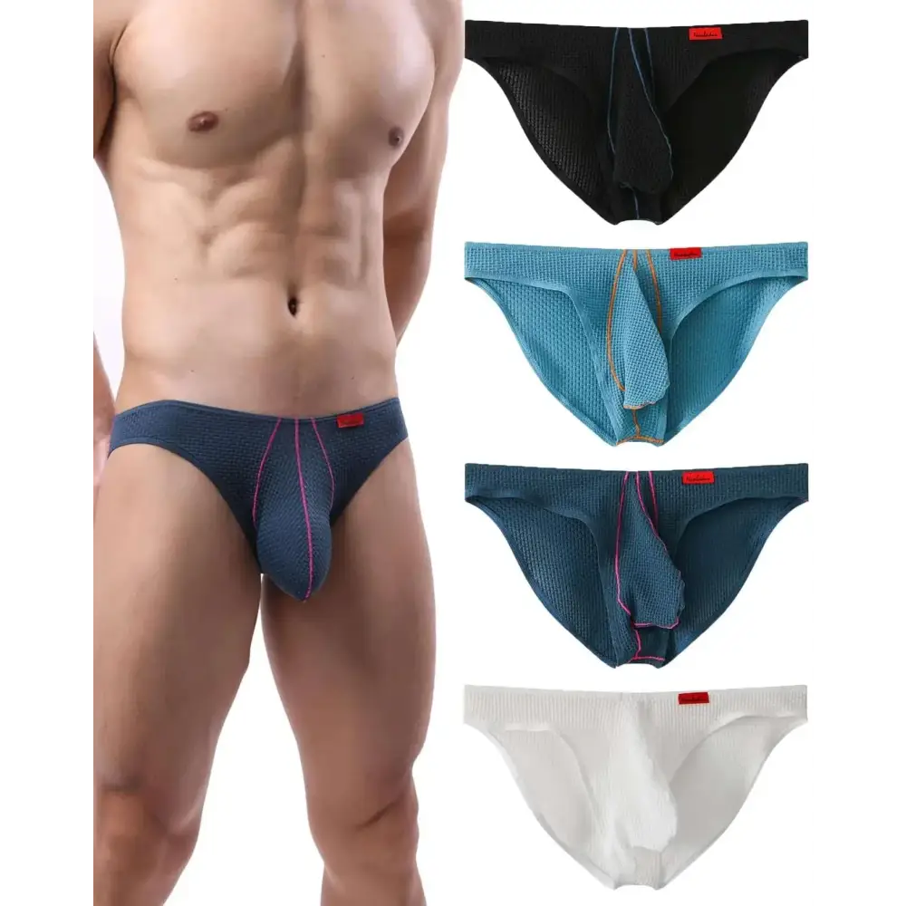 Low rise textured mens briefs in dark blue featuring pink stitching and a red brand tag on the front side