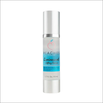 Silver-topped glass bottle of luminous face lift serum with vitamins a b c e and translucent blue label with pink peach logo