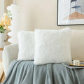 Luxurious soft faux fur throw pillow cushion covers in white with a fluffy plush texture for home decor
