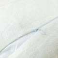 White plush luxurious soft faux fur throw pillow cover with a silver zipper detail for cushion covers
