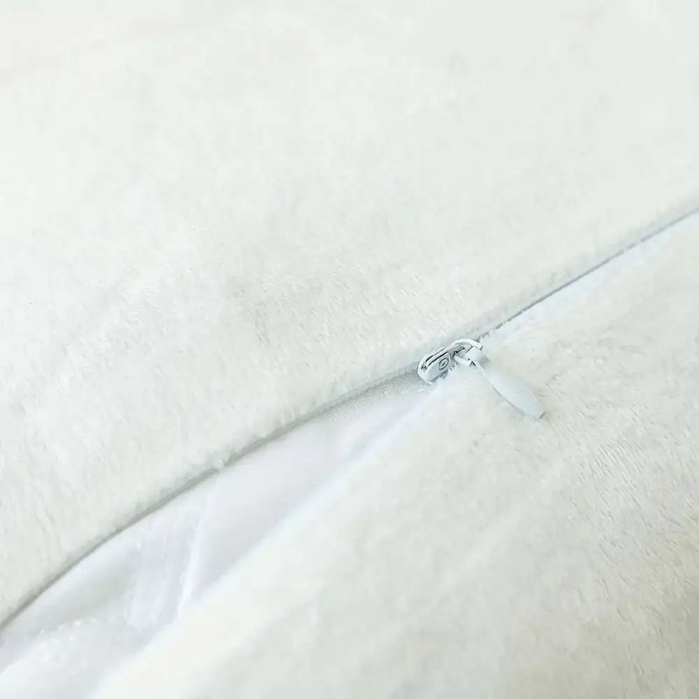 White plush luxurious soft faux fur throw pillow cover with a silver zipper detail for cushion covers