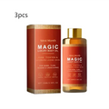 A sleek amber glass bottle with gold cap and red label containing west month magic luxury amber soothing body oil