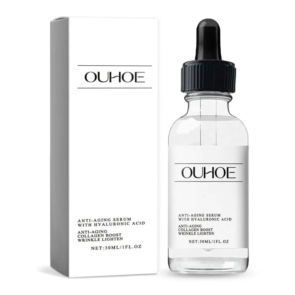 Clear glass luxury anti-aging serum bottle with black dropper cap and minimalist white ouhooe label for women