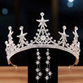Luxury atmosphere bridal crown in silver with intricate star and snowflake designs embellished with clear crystals