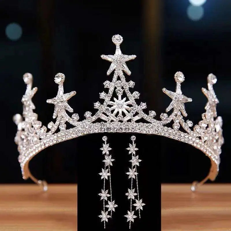 Luxury atmosphere bridal crown in silver with intricate star and snowflake designs embellished with clear crystals