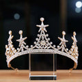 Luxury atmosphere bridal crown featuring a sparkling gold tiara with clear crystals and intricate star embellishments