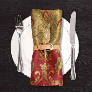 Luxury Christmas cloth dinner napkins 4 pack featuring gold and red patterned silk secured with leather belt and brass feather clip