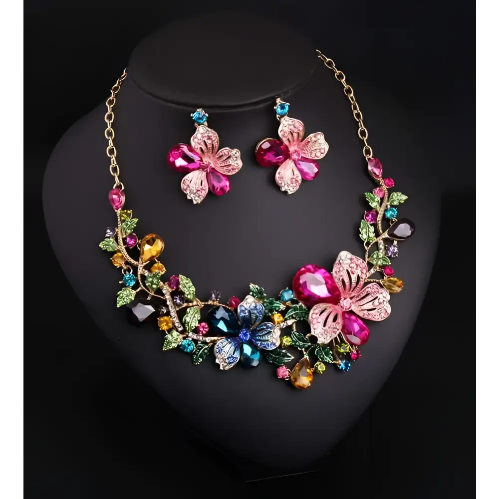 A luxury color flower crystal jewelry set featuring a vibrant multi-colored floral necklace with pink and blue gemstones