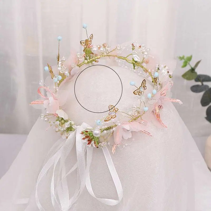 Delicate pink and gold floral bridal wreath with gold butterfly charms pearls and light blue beads for bridal wear