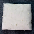 A delicate white sheer luxury heavy industry bridal pearl veil adorned with scattered pearl-like beads and tiara