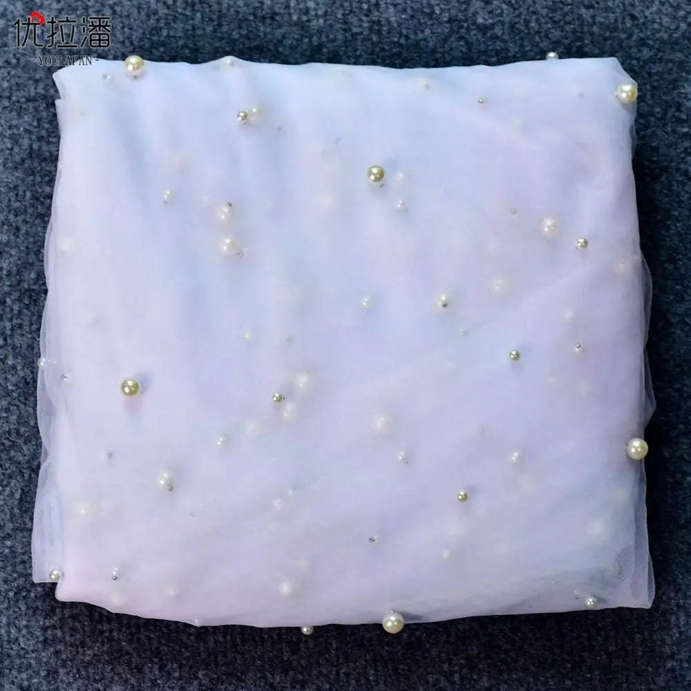 Luxury heavy industry bridal pearl veil in delicate lavender sheer fabric with scattered pearl-like beads and metallic accents