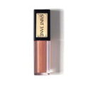 Saint jane luxury lip oil in a sleek black and gold tube with shimmering rose gold liquid for a radiant finish