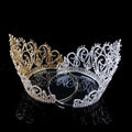 Elegant gold and silver bridal crown with intricate crystal embellishments and starburst accent for luxury bridal wear