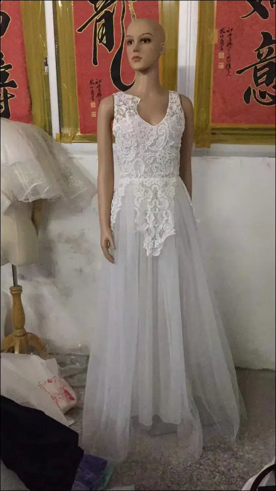 Luxury women’s fashion white floral lace wedding dress with fitted bodice and flowing tulle skirt perfect for weddings