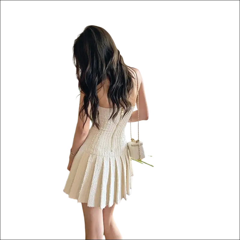 A cream-colored, sleeveless luxury women’s fashion tweed mini dress with a corset-style back detail