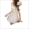 Luxury women’s fashion cream-colored tweed mini dress with square neckline shoulder straps and gold-tone buttons down front