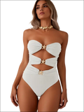 Luxury women’s fashion white one-piece swimsuit with star-shaped gold hardware and cut-out details for stylish beachwear