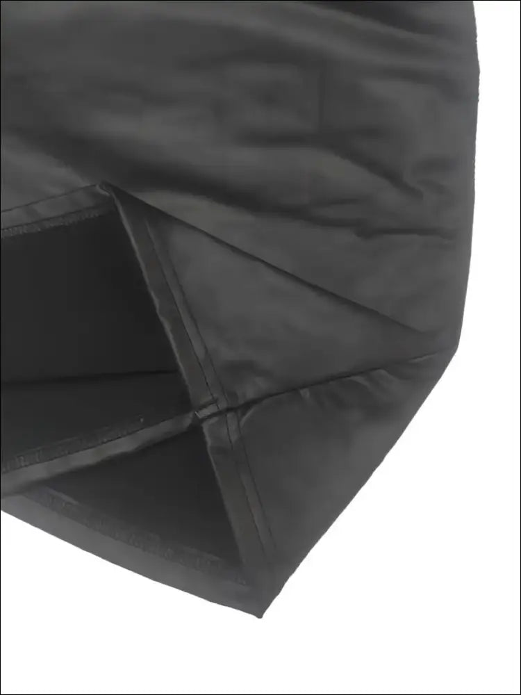 Black quilted faux leather bag with stitched seams and padded design complements luxury women’s fashion