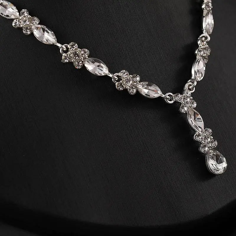 Luxury zircon necklace and earrings set featuring a sparkling silver design with clear marquise and teardrop crystals