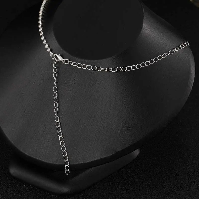 Luxury zircon necklace and earrings set featuring a silver chain choker with beaded edge and adjustable extension