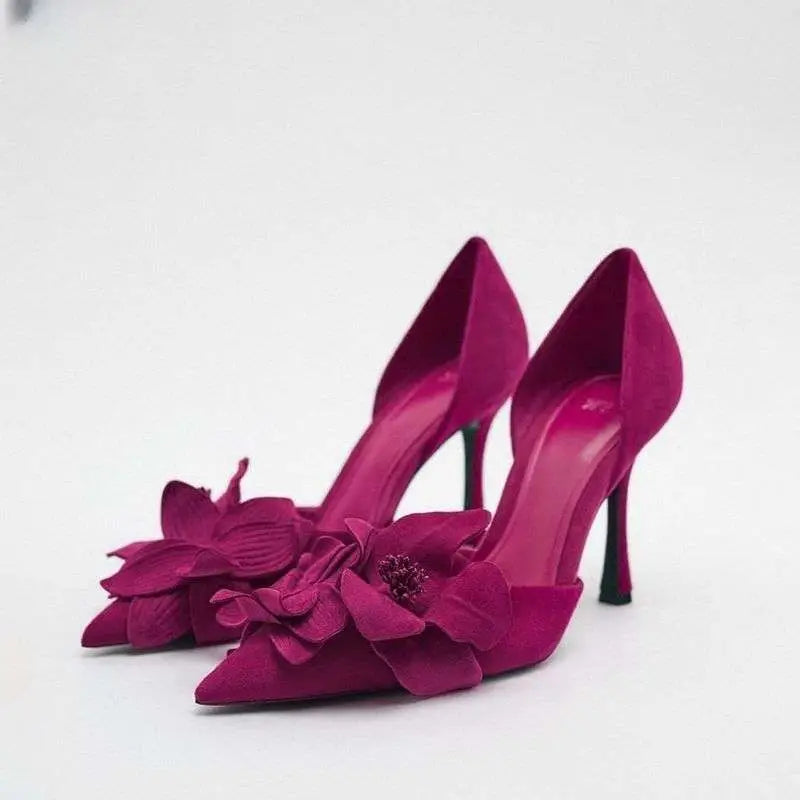 A vibrant magenta flower high heels suede pump with pointed toe beautiful pumps featuring floral embellishment