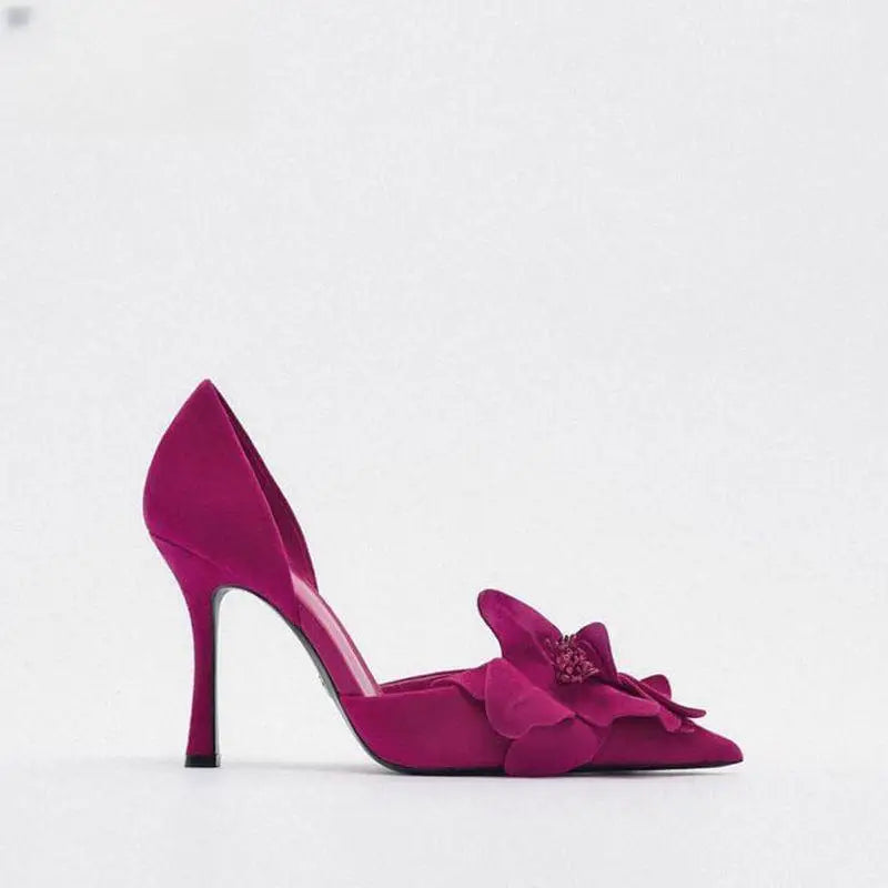 A vibrant magenta flower high heels suede pump with pointed toe beautiful pumps featuring floral embellishment