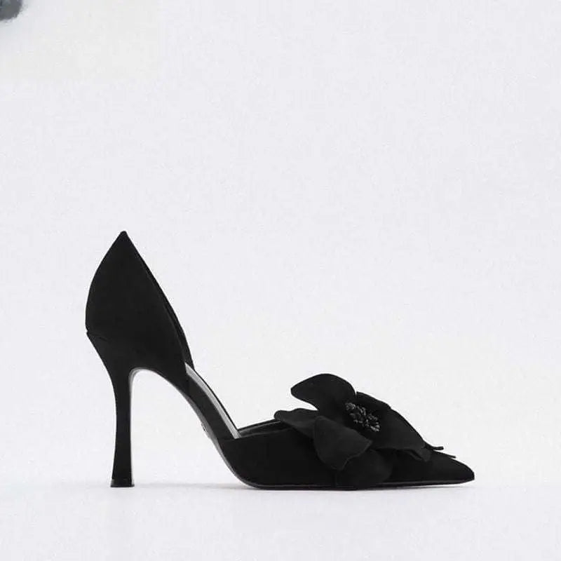 Black suede flower high heels with pointed toe and decorative bow adorned with sparkling embellishment