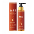 Golden pump bottle of magic luxury body oil with amber liquid and black pump next to orange luxury body oil box