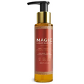 A sleek amber glass bottle with gold pump and black cap labeled magic luxury body oil for luxury body care