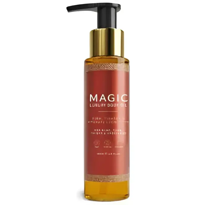 A sleek amber glass bottle with gold pump and black cap labeled magic luxury body oil for luxury body care