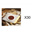White mesh-backed magnetic slimming belly button patch with brown center and metallic disc on yellow adhesive strip