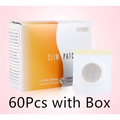 White and orange magnetic slimming belly button patch with circular mesh design for effective button patch slimming