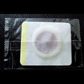 White square magnetic slimming belly button patch with circular textured center and yellow border for button patch slimming