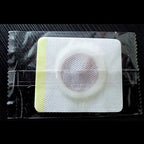 White square magnetic slimming belly button patch with circular textured center and yellow border for button patch slimming