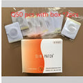 Orange and white magnetic slimming belly button patch box with 50 individually wrapped slim adhesive pads for slimming