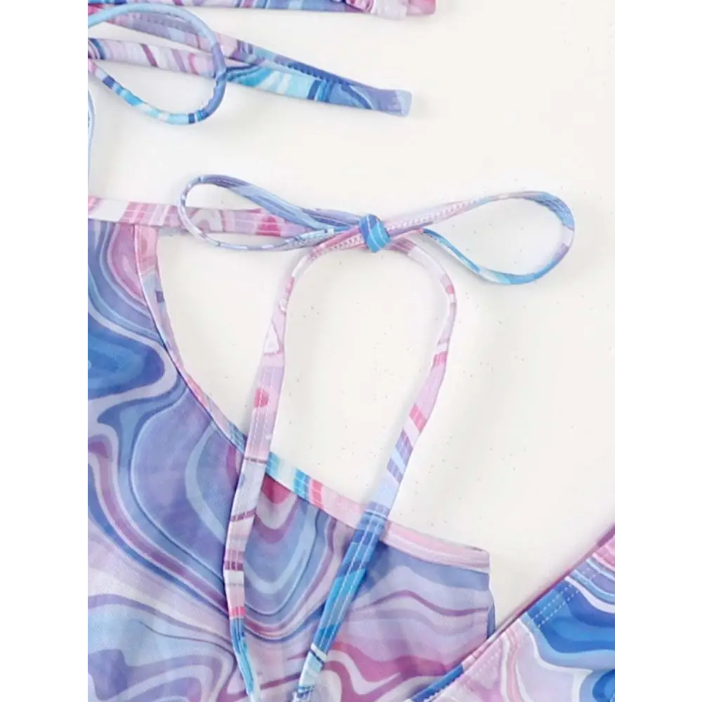 Pastel blue and pink wavy bikini top with tie straps from marbled pink and blue bikini 3-piece beach skirt set