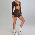 Brown long-sleeved crop top with twisted front and matching high waist shorts in maroon high waist suit outdoor running nude set
