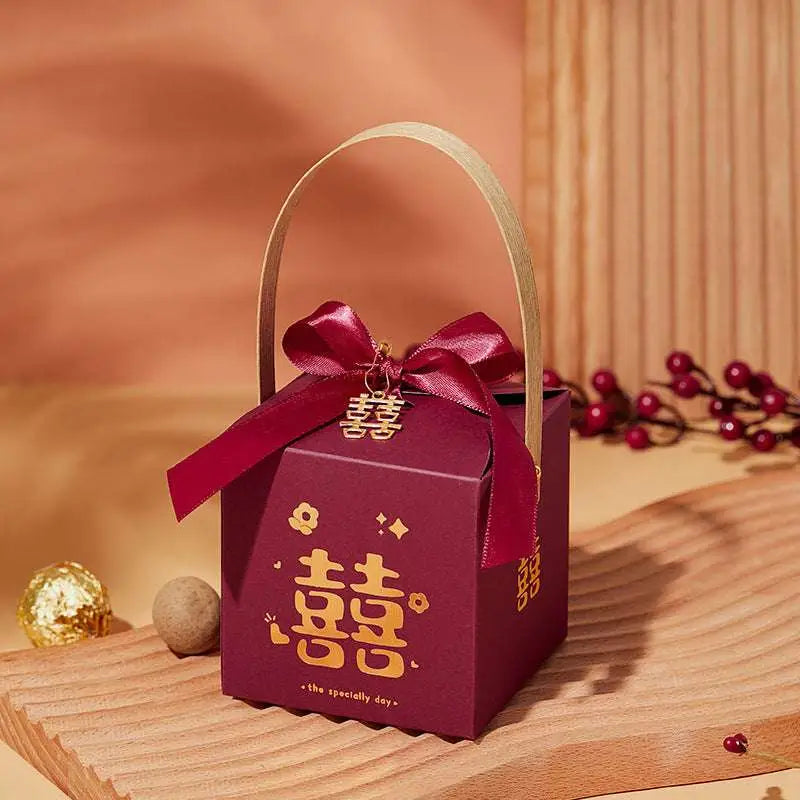 Maroon minimalist wedding candy gift box with gold double happiness symbol and matching ribbon bow for favors
