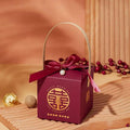 Maroon minimalist wedding candy gift box with gold handle featuring a ribbon bow and pearl charm for a fashion simple look