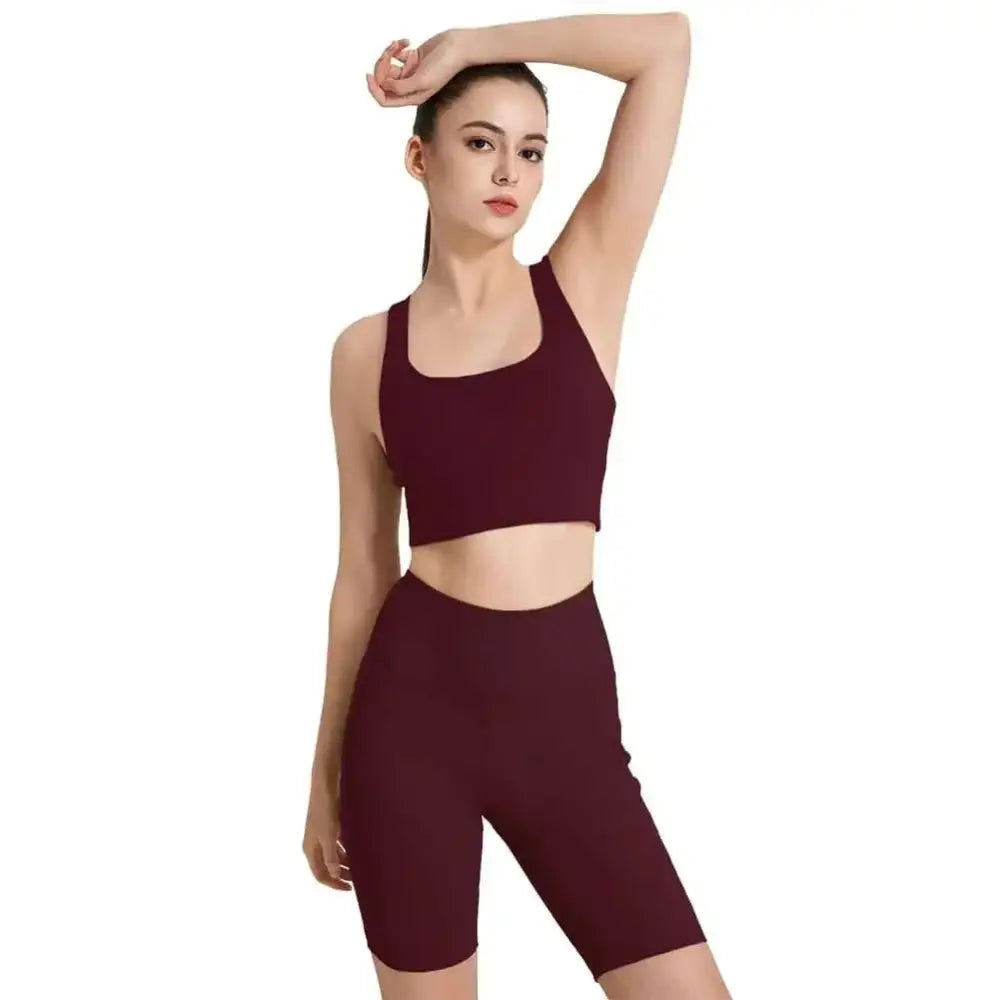 Maroon seamless sports bra and biker shorts set in stretchy fabric designed for yoga pilates and athletic wear