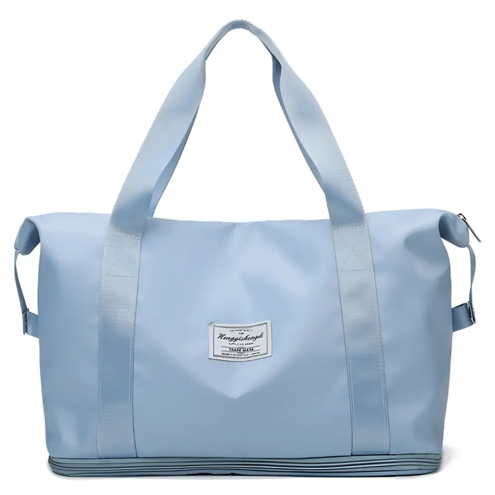Light blue durable nylon travel duffel bag with reinforced handles and a labeled patch designed for maroon wet separation sports