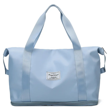 Light blue durable nylon travel duffel bag with reinforced handles and a labeled patch designed for maroon wet separation sports