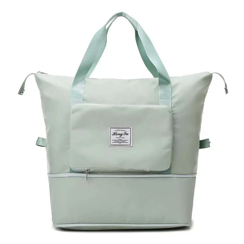 A light mint green foldable travel bag with sturdy handles and label designed for maroon wet separation sports use