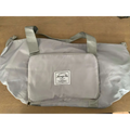 Light gray lightweight travel duffel bag with front zippered pocket and label designed for maroon wet separation sports