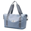 Light blue durable nylon duffel bag with gray reinforced straps and a label designed for maroon wet separation sports use